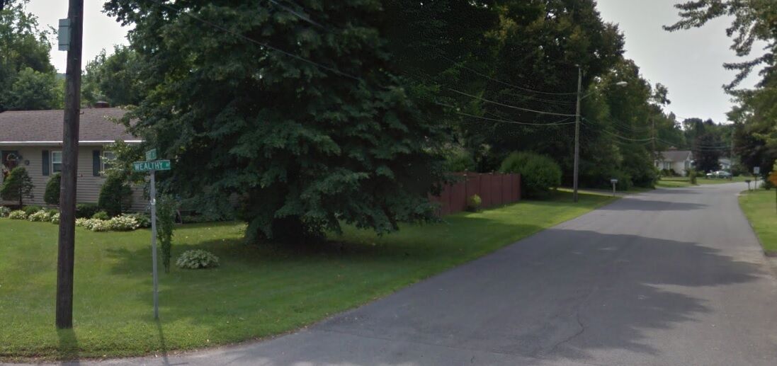 Wealthy Avenue street sign and road